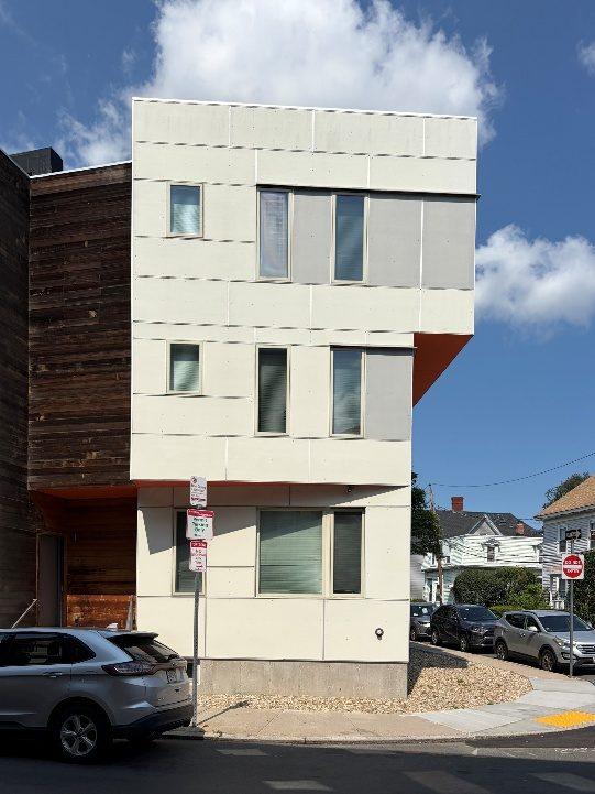 A modern Allston building with an irregular facade